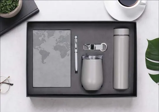 Grey Caffeine Fix gift set with map-embossed diary, pen, keychain, lidded tumbler and temperature-display flask in a black tray.