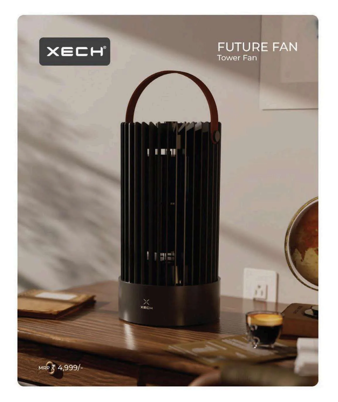 Glossy black XECH Future Fan tower fan with tan leather handle on a wooden desk