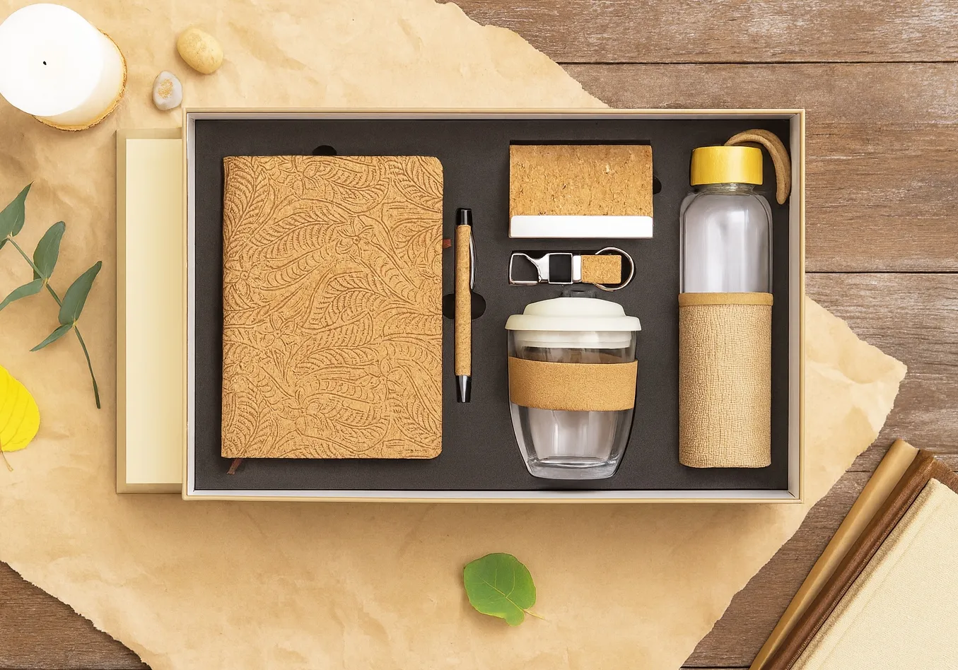 Cork-themed 6-in-1 gift set with embossed diary, pen, power bank, keyring, glass coffee tumbler and cork-sleeved bottle in a kraft box.