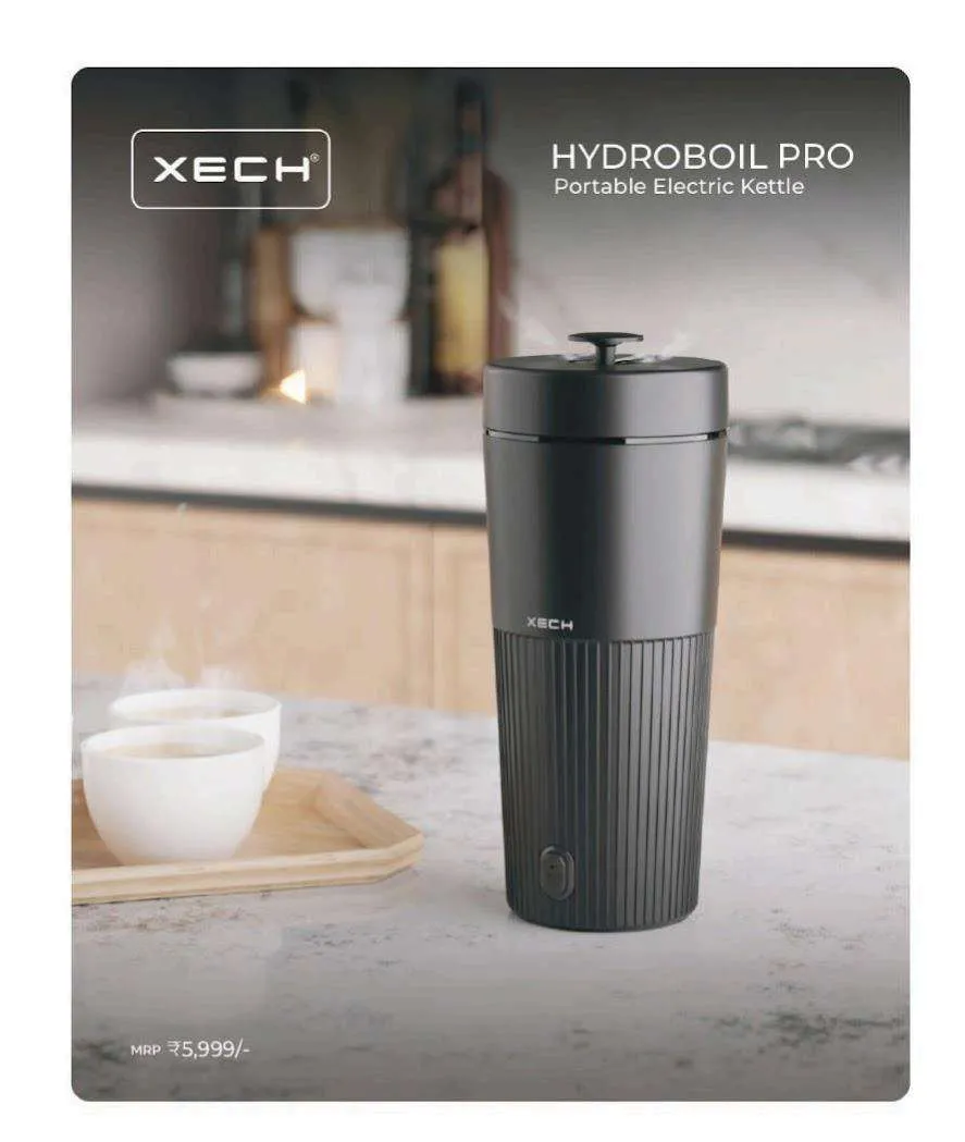 XECH Hydroboil Pro black tumbler-shaped portable electric kettle with a ribbed base on a marble counter.