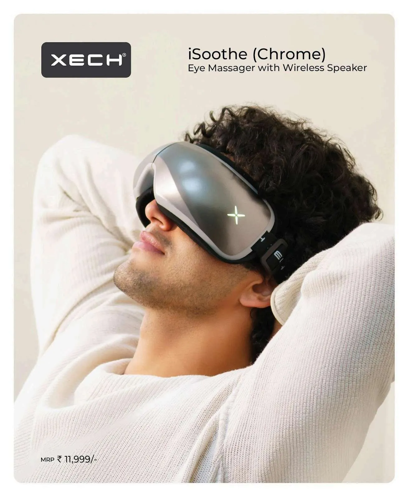 XECH iSoothe Chrome eye massager with wireless speaker worn by a reclining man, silver metallic shell
