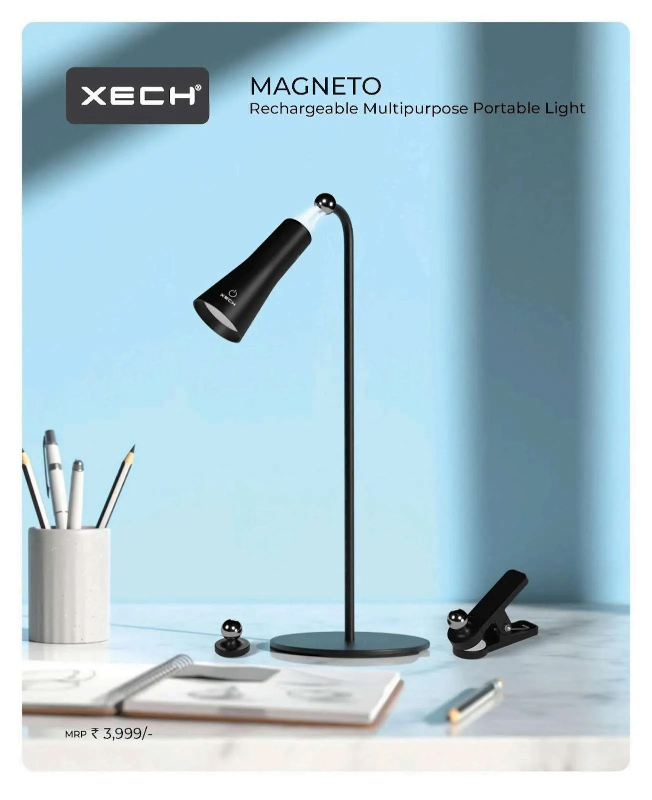 Black XECH Magneto rechargeable desk lamp with magnetic head, clip and ball mount on a blue desk scene