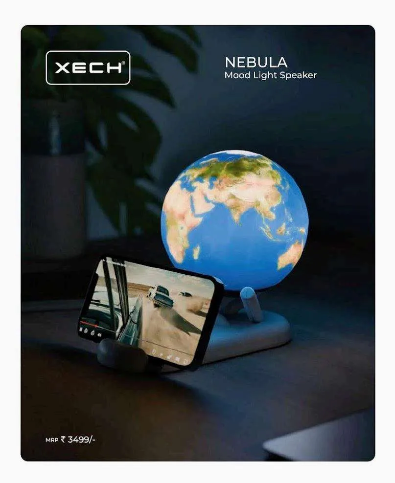 Glowing Earth-globe XECH Nebula mood light speaker with a phone propped in the base playing a video