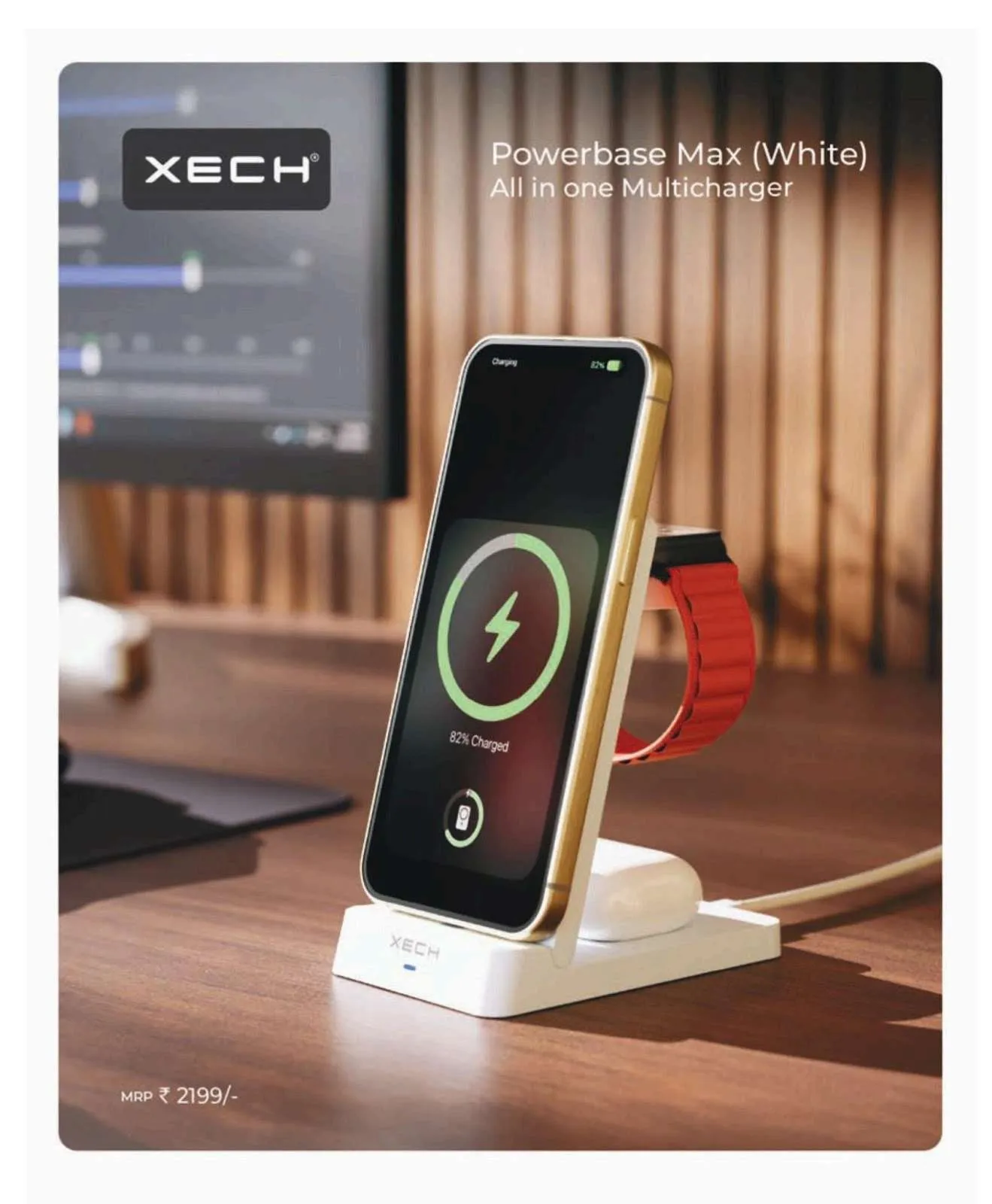 White XECH Powerbase Max multicharger holding an upright phone, a smartwatch with orange band and an earbuds case on a wooden desk.