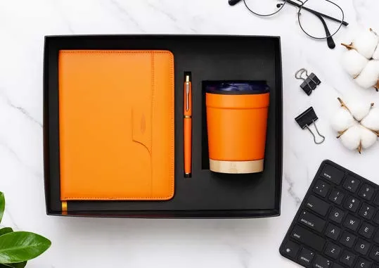 Orange leatherette diary, matching pen and insulated tumbler with wooden base in a gift box