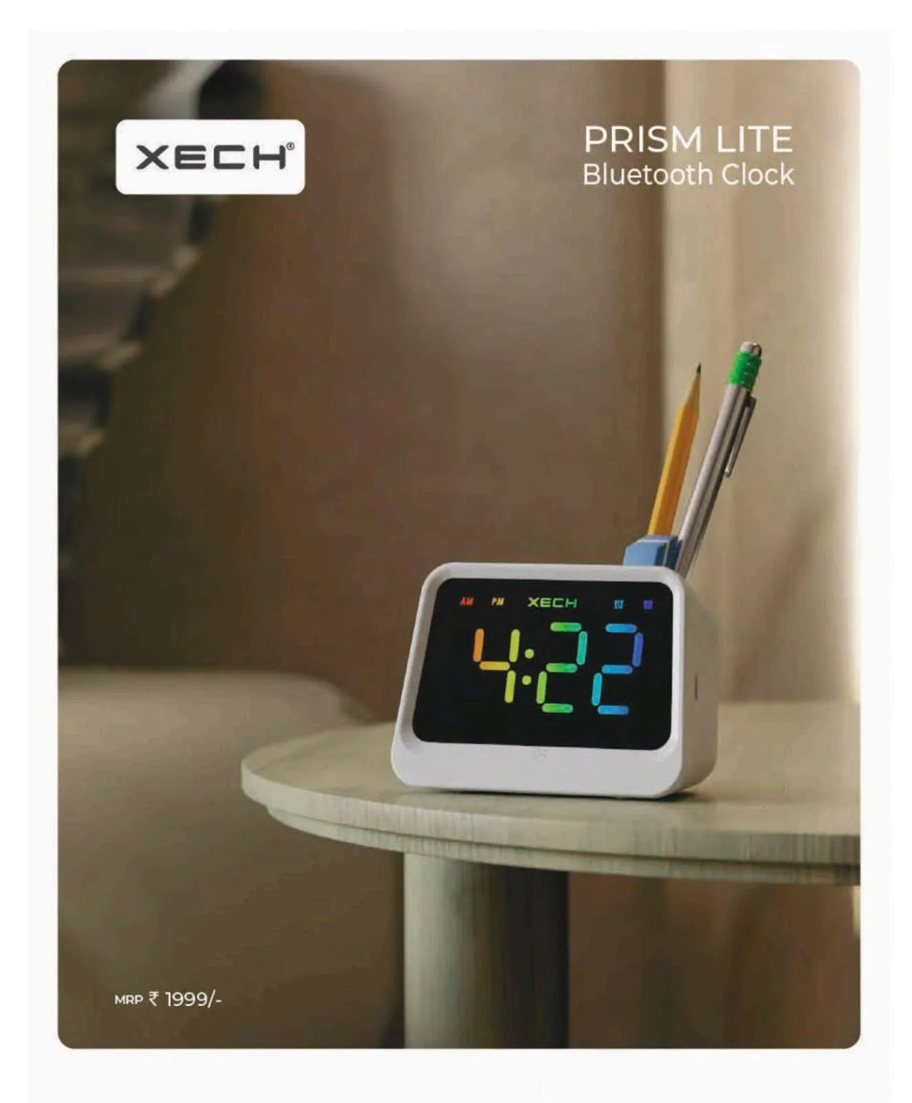 XECH Prism Lite white Bluetooth desk clock with rainbow LED display and pens in its holder