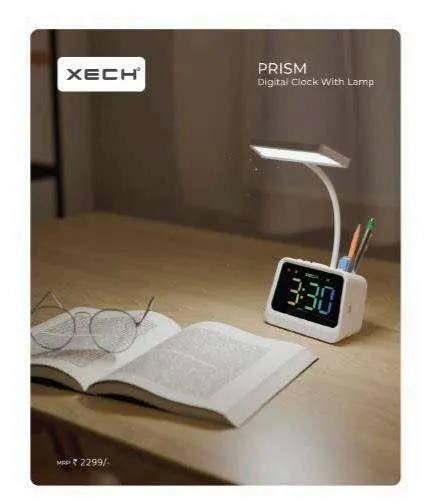 XECH Prism white desk clock with gooseneck LED lamp and pen holder beside an open book