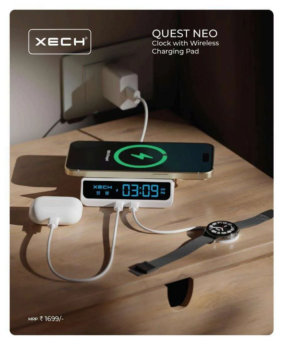 White XECH Quest Neo clock with wireless charging pad charging a phone, showing 03:09 on a blue LED display, with earbuds and a watch nearby.