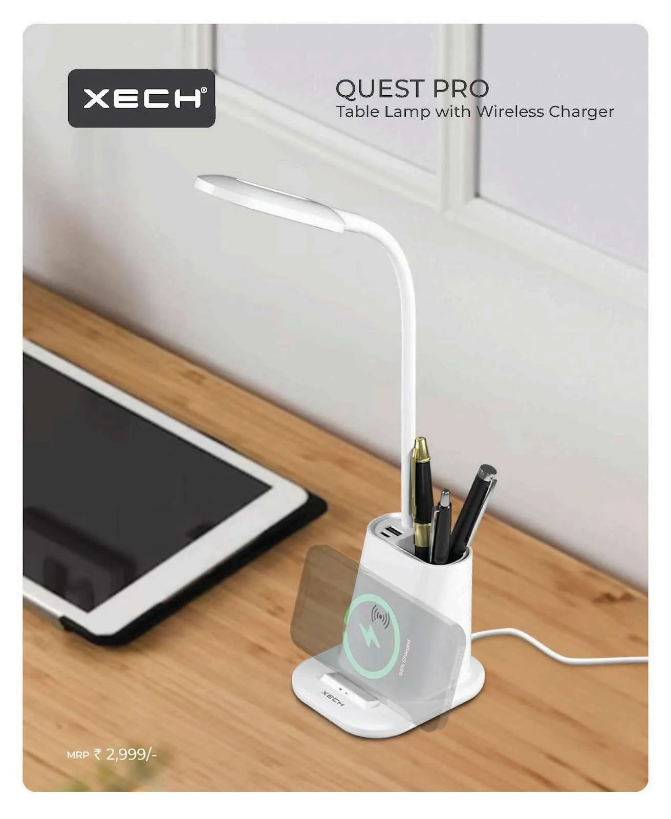 White XECH Quest Pro desk lamp with gooseneck, pen holder and wireless charging stand on a wooden desk beside a tablet.
