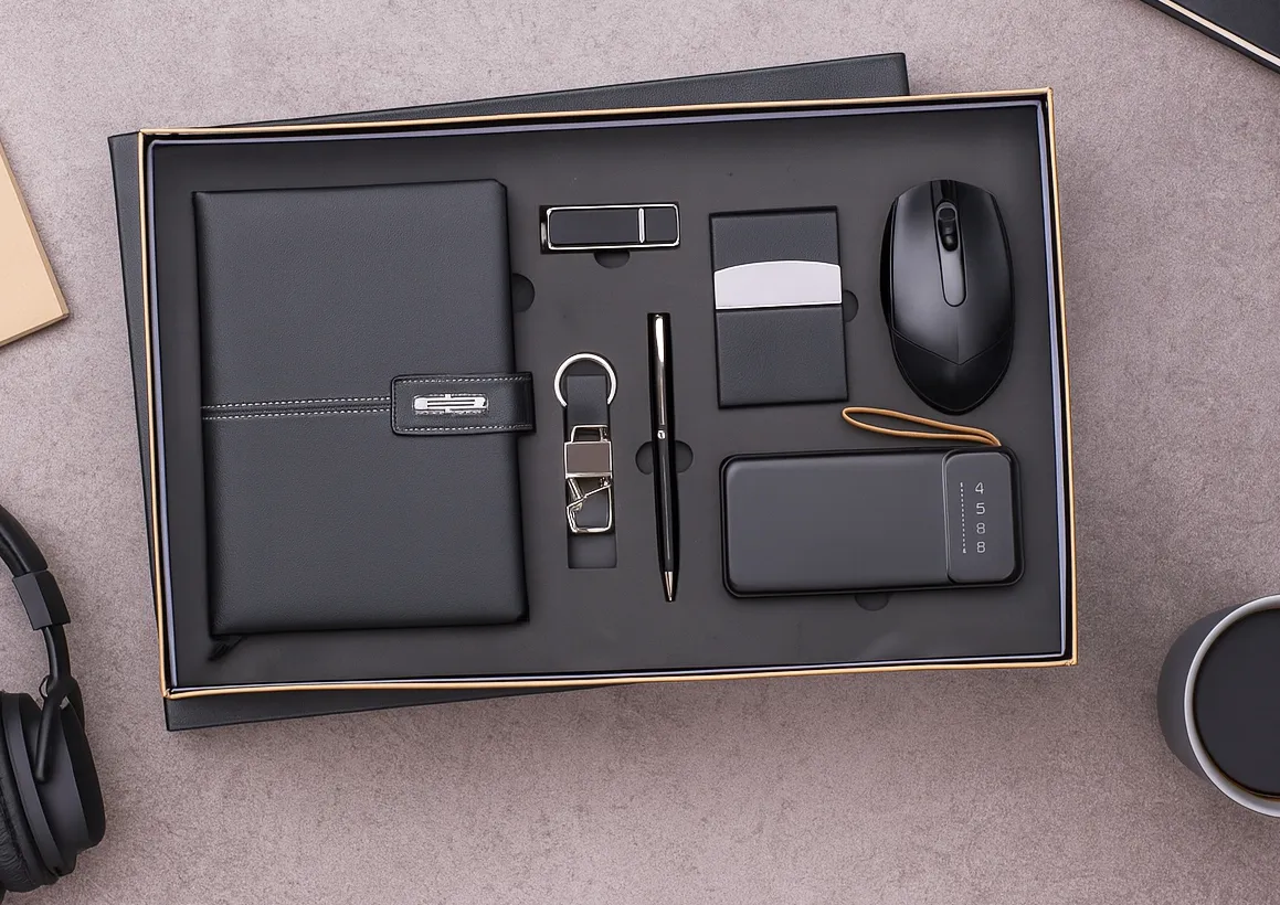 Black 7-in-1 gift set in foam-lined box: leatherette diary, pen, keychain, cardholder, wireless mouse, USB drive and power bank.