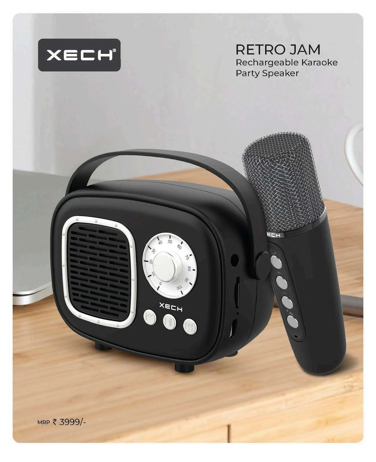 Matte black XECH Retro Jam radio-style karaoke speaker with a wireless microphone on a wooden surface