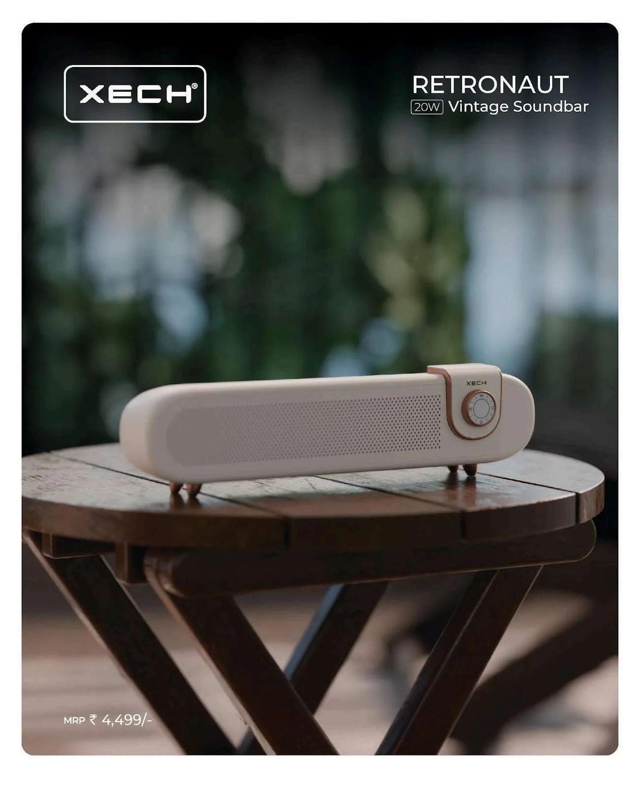 Cream XECH Retronaut soundbar with rose-gold dial on a wooden table outdoors