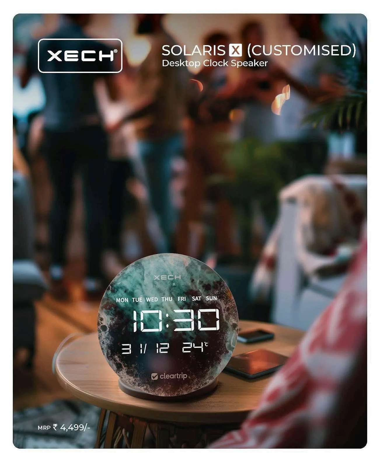 XECH Solaris X round marble-finish desktop clock speaker showing 10:30 on a wooden table