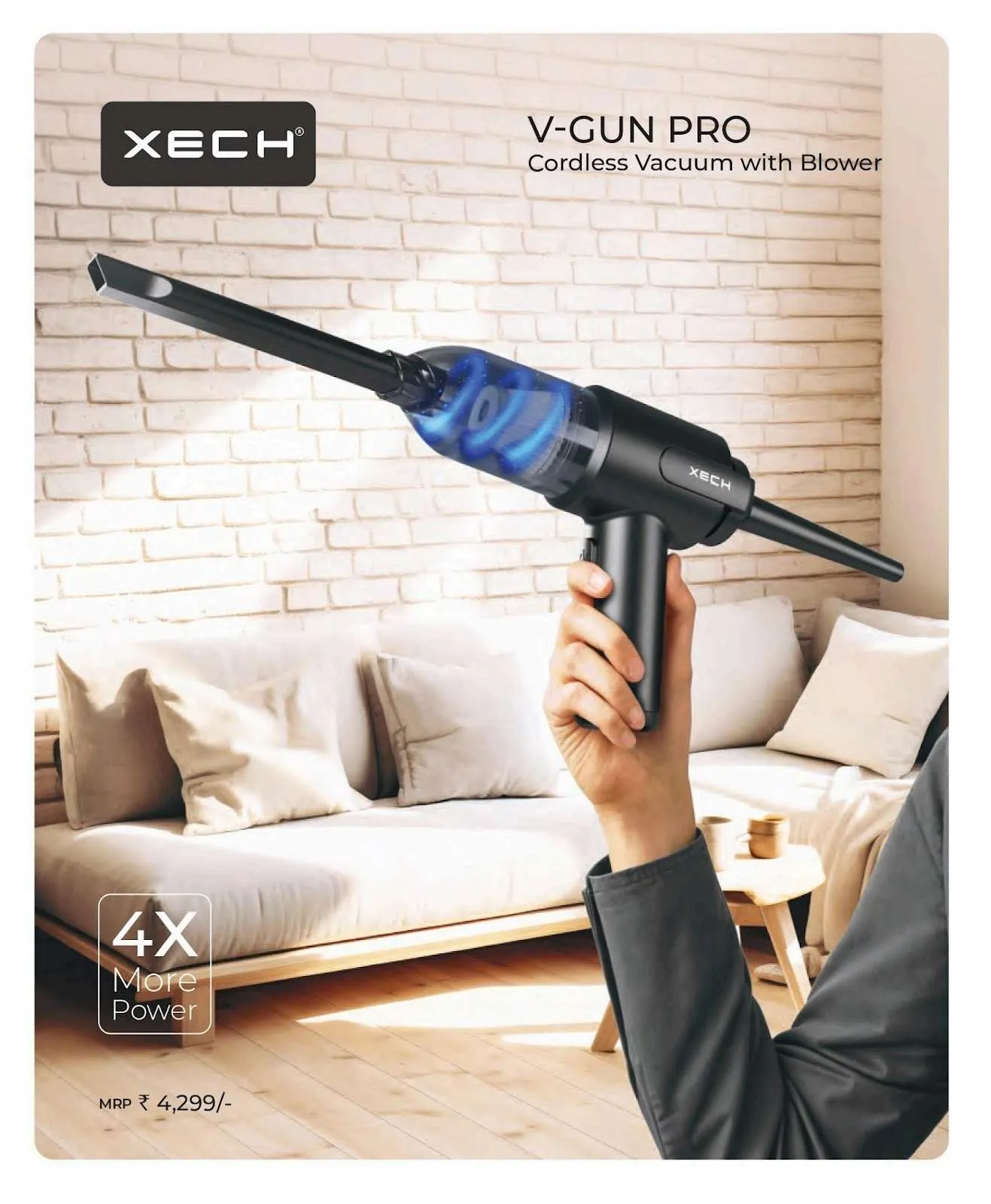 Hand holding the black XECH V-Gun Pro cordless vacuum with slim nozzle and glowing dust chamber in a bright living room.