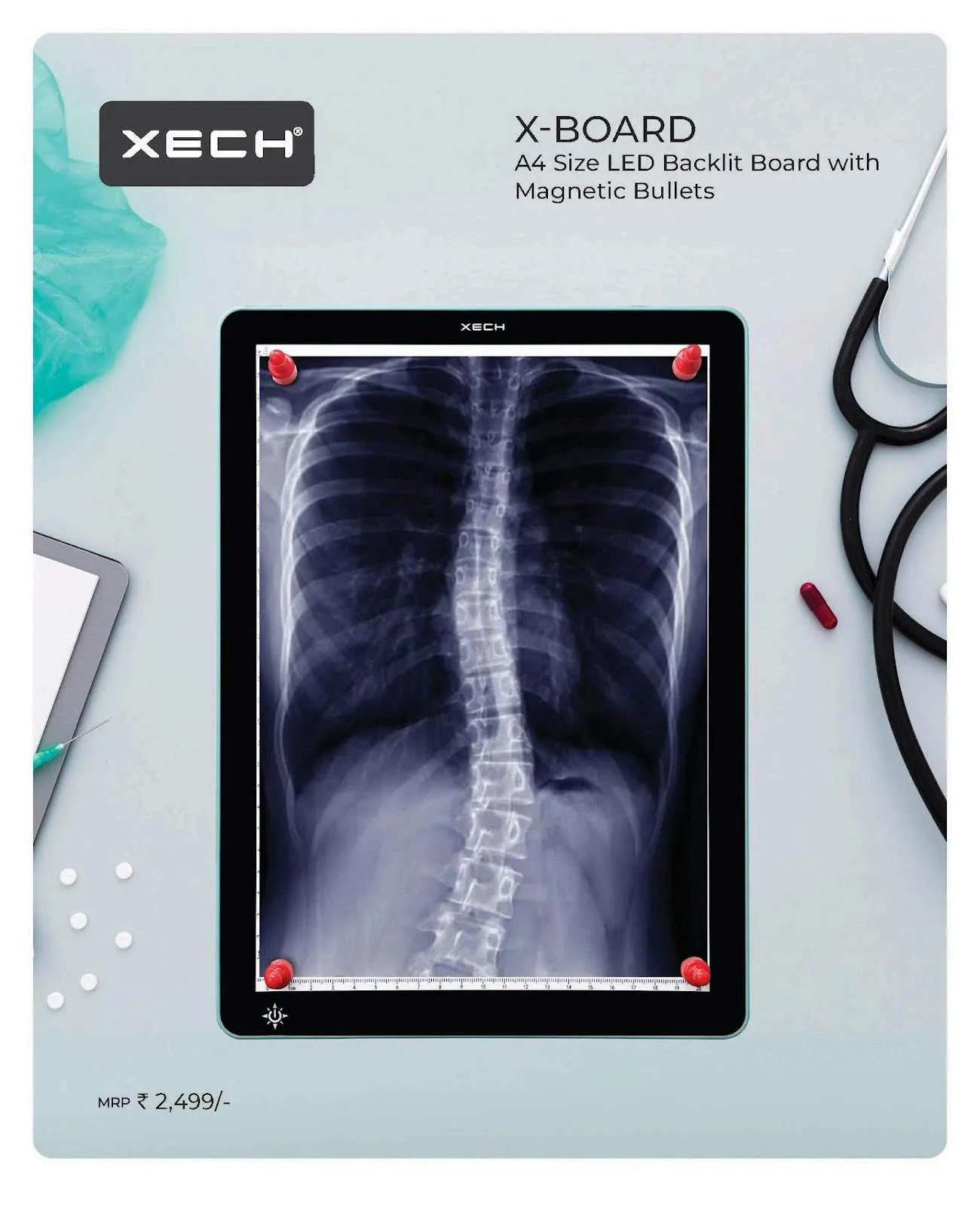 Slim black A4 XECH X-Board LED light box backlighting a chest X-ray, held by red magnetic clips on a clinic desk.
